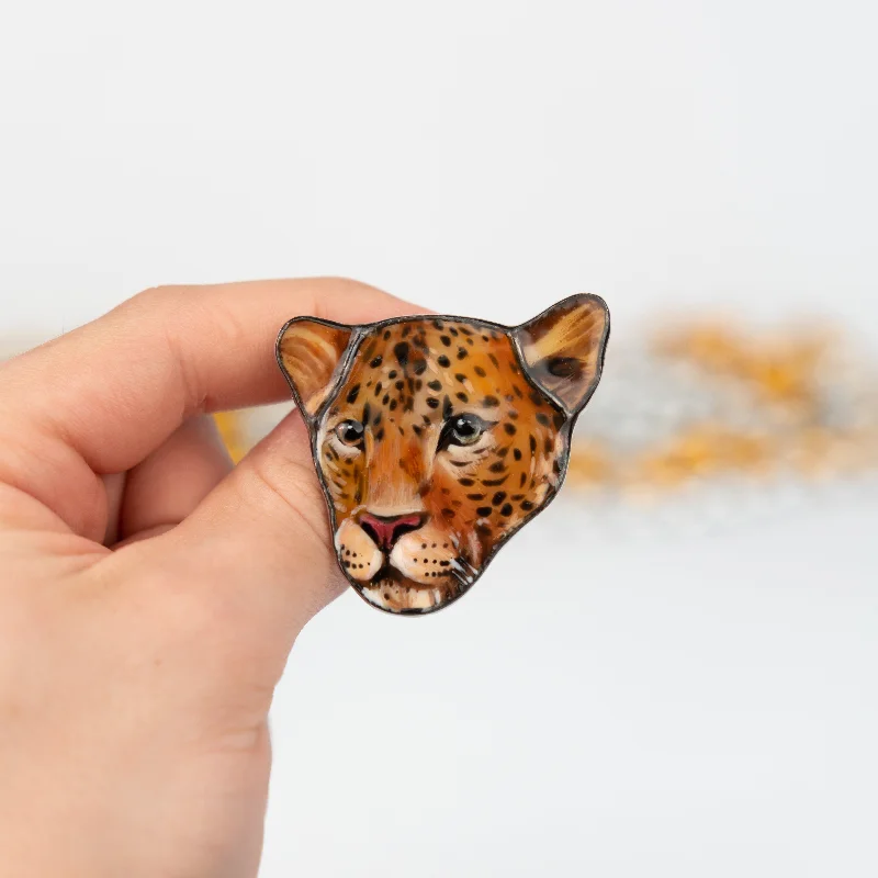 Leo Brooches